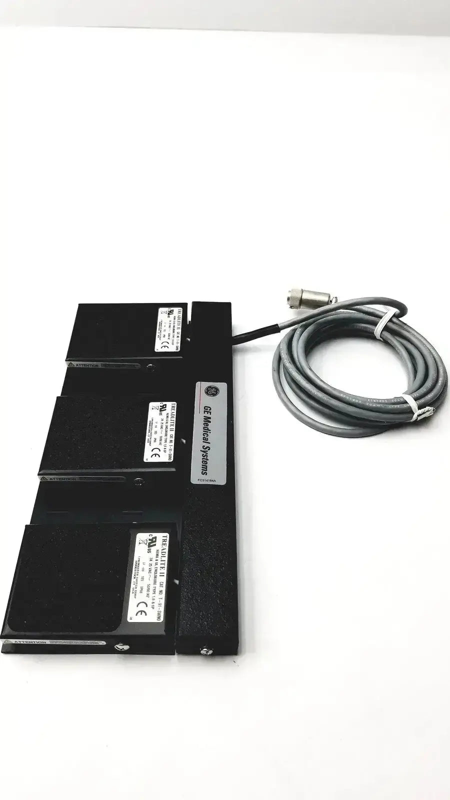 Black ge medical systems footswitch with three stacked modules and coiled gray cable for durable systems footswitch use