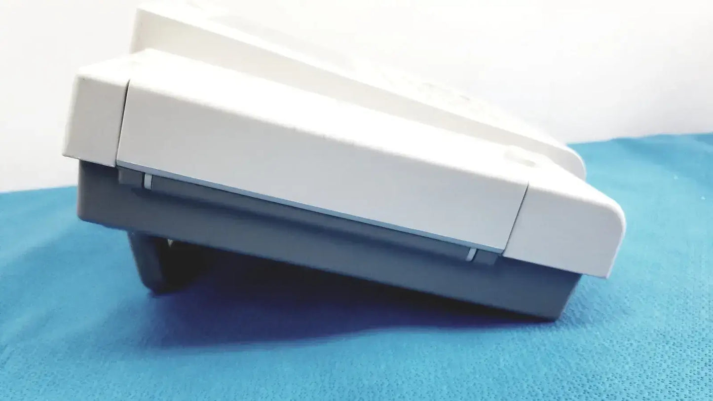 White and gray plastic ecg machine with rectangular two-tiered design from GE Medical Systems MAC 800 medical systems mac