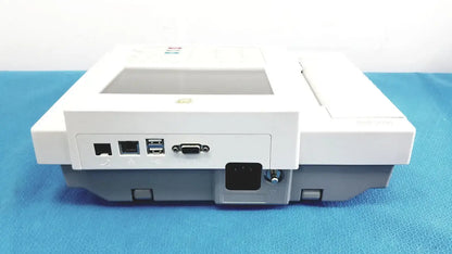 Back view of white and gray ge medical systems mac 800 ecg machine with multiple ports including usb and ethernet
