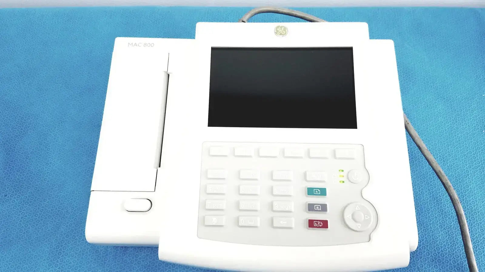 White ge medical systems mac 800 ecg machine with black screen numeric keypad and colored function buttons