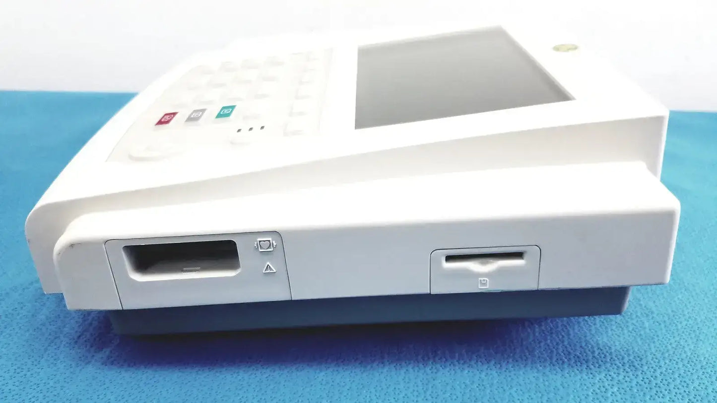 White ge medical systems mac 800 ecg machine with touchscreen display keypad and card slots for medical use