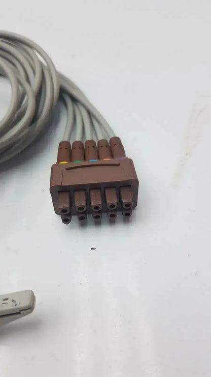 Brown plastic medical cable connector with six colored pins for ge multi-link ecg leadwire 5-lead v2-6 grabber