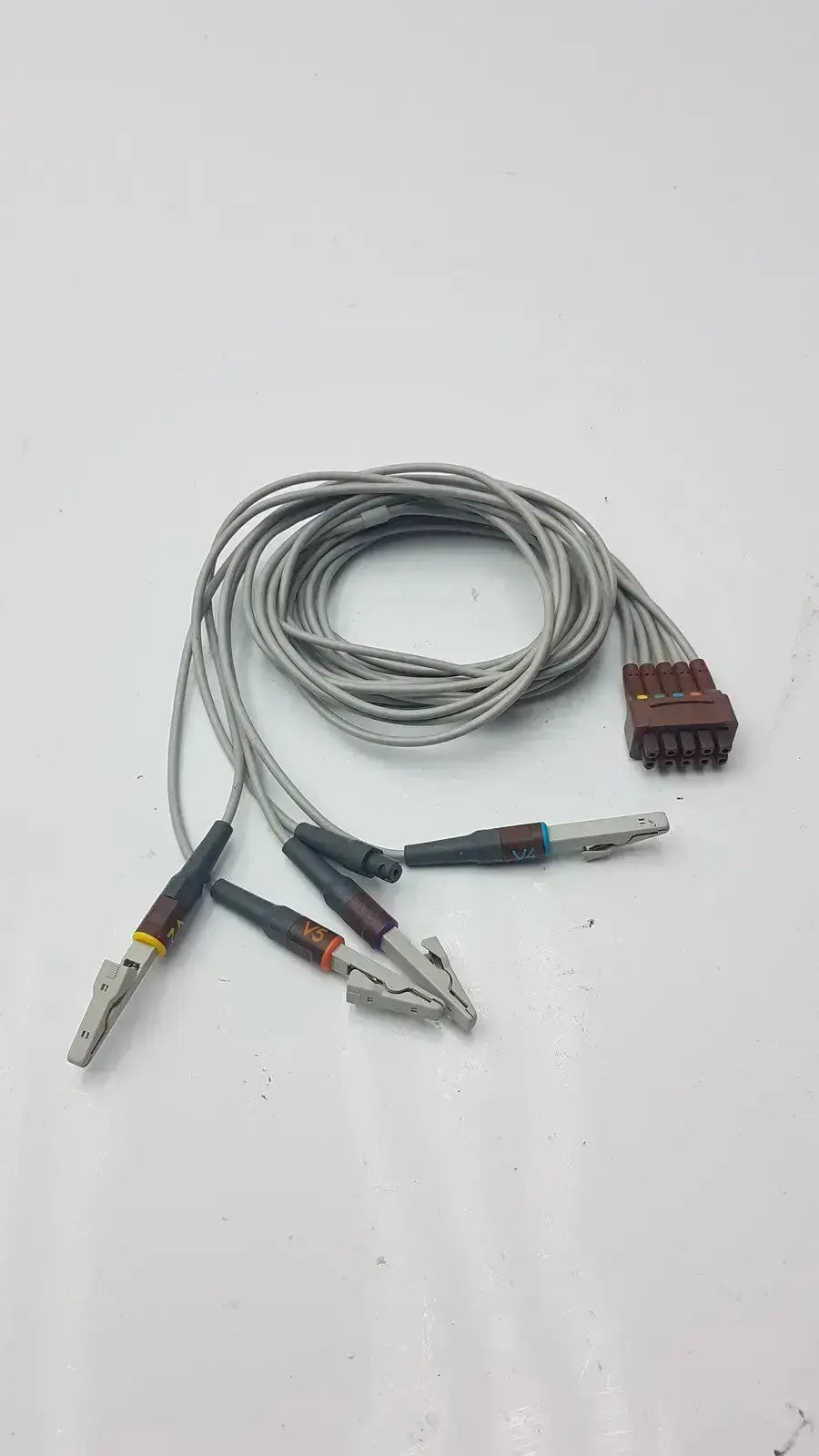 Gray coiled multi-link ecg leadwire 5-lead v2-6 with alligator clips and brown multi-pin connector for medical use
