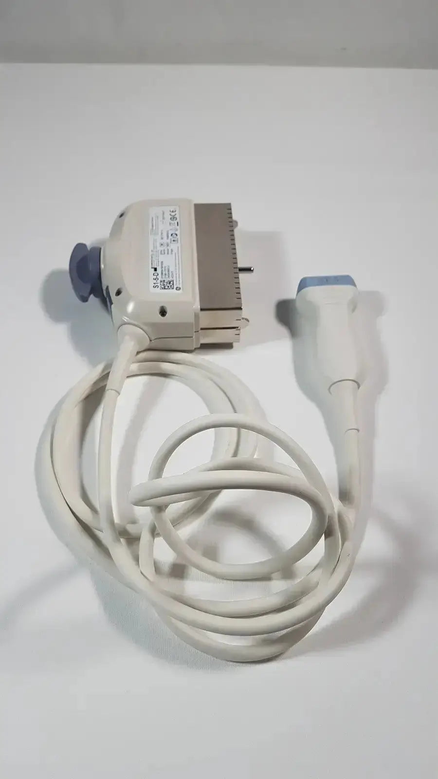 White ge s1-5-d phased array ultrasound probe with blue-tipped probe, beige housing, and coiled cable for medical use