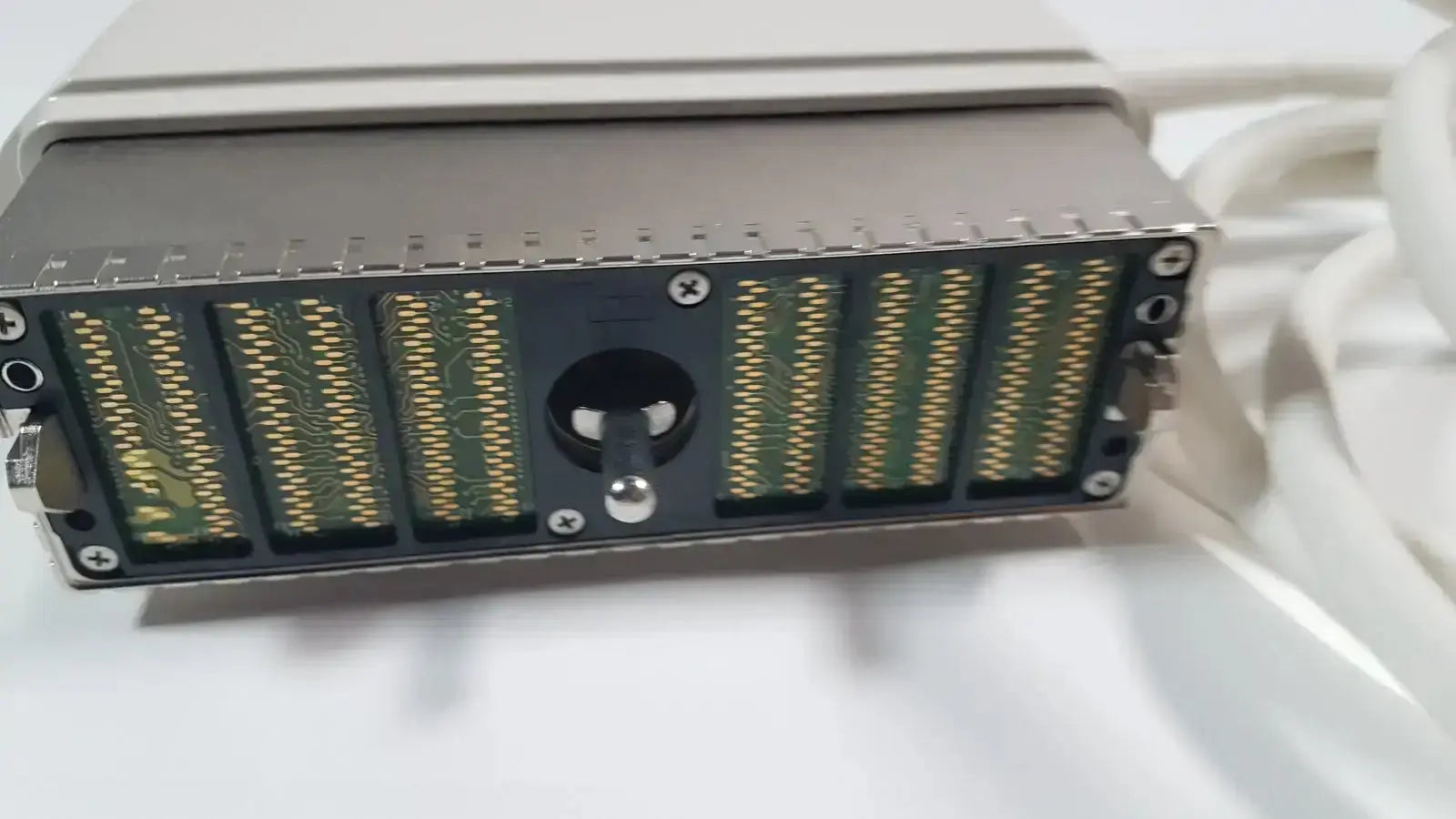 Silver metallic server rack module with green circuit boards and gold connectors in ge s1-5-d phased array ultrasound probe
