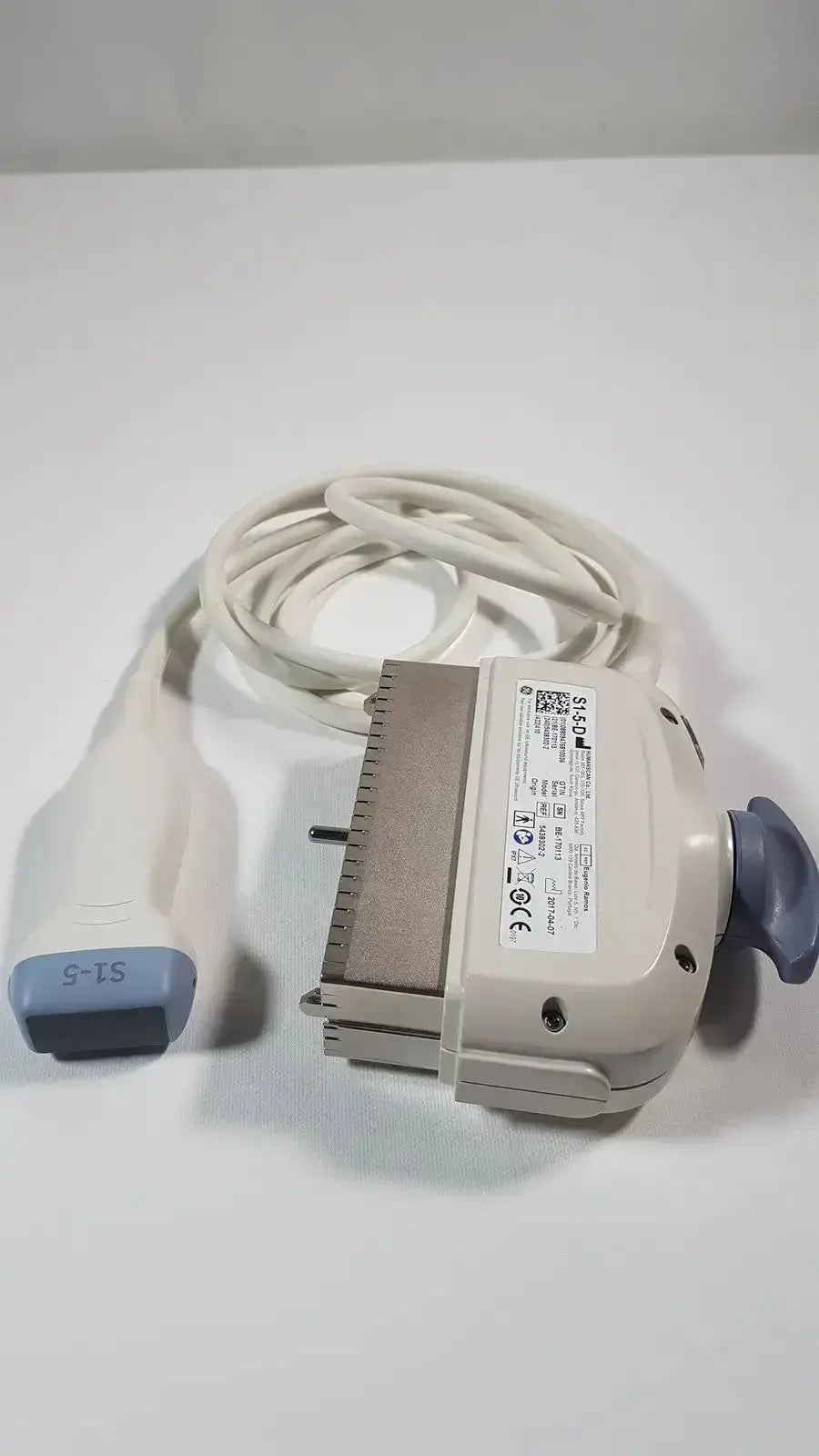 Beige and gray ge s1-5-d phased array ultrasound probe with coiled white cable and blue-labeled s1-5 tip