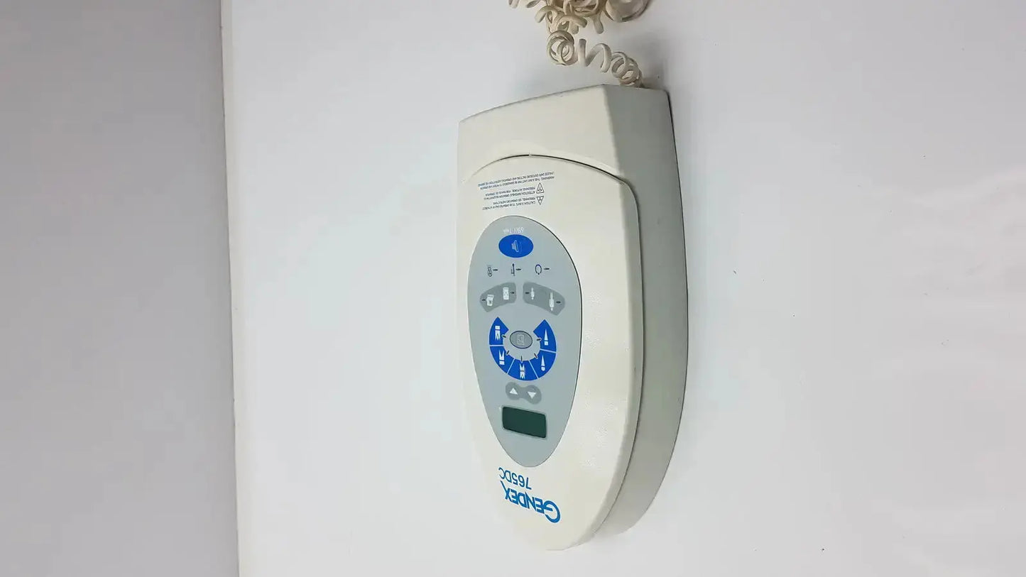 Off-white Gendex 765DC xray remote control panel with blue circular buttons and digital display branded cerebral 7650