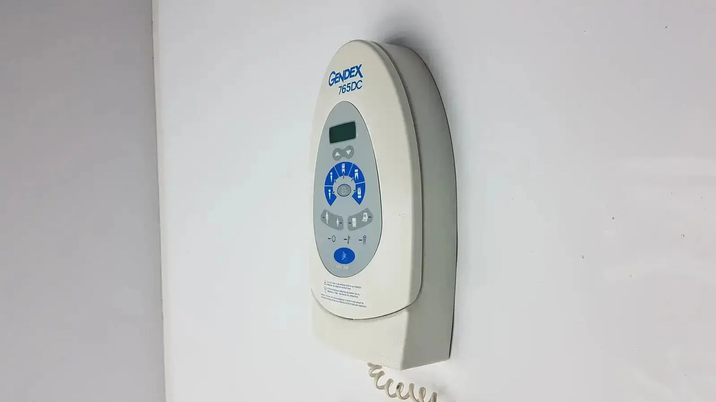 White wall-mounted Gendex 785dc remote control panel with digital display and blue buttons for Xray remote control use