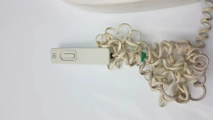 Beige plastic gendex 765dc xray remote control panel with coiled beige cord for precise remote control use