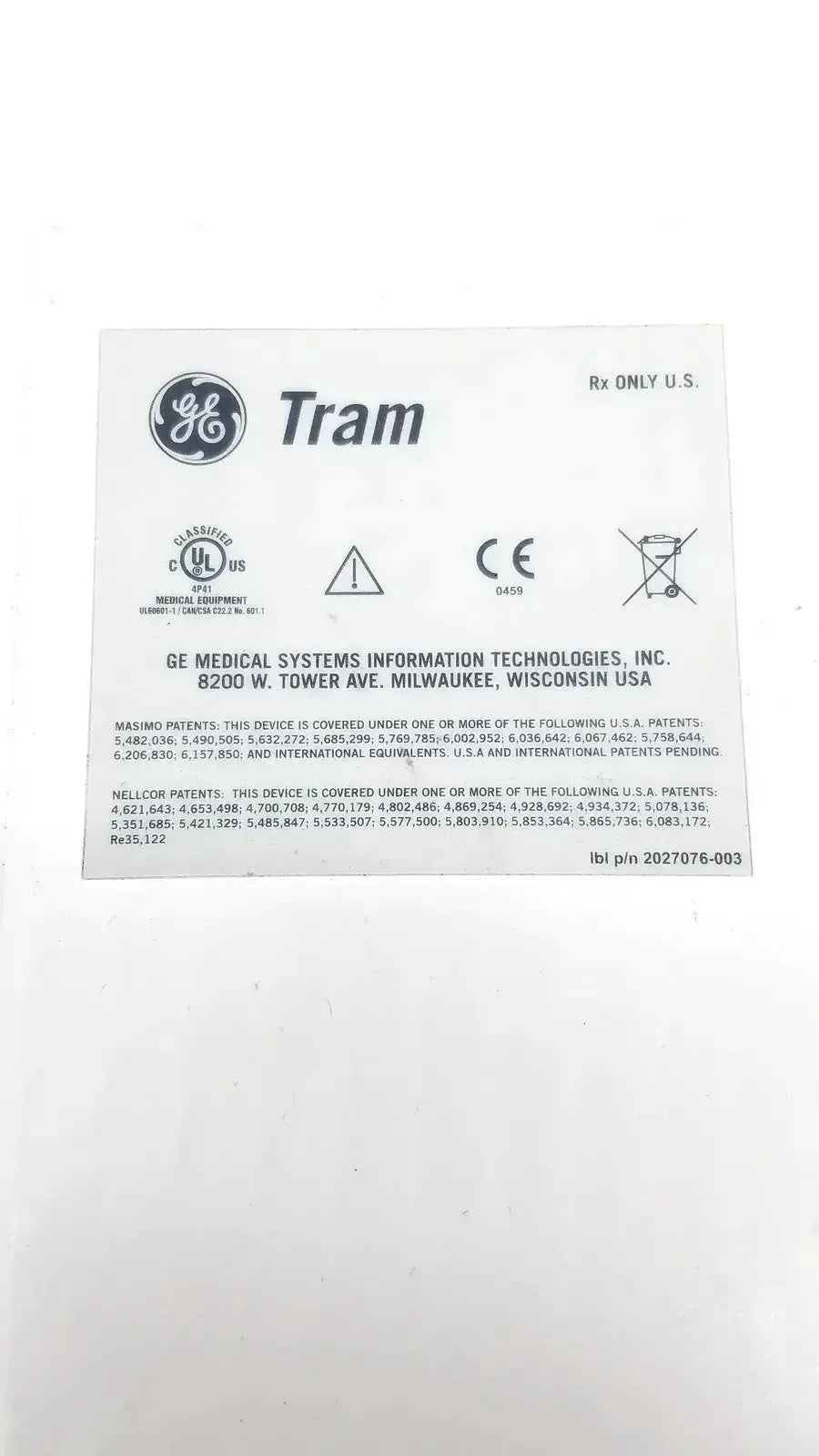White rectangular label with black text and logos on the back side of a general electric medical systems 451m patient monitor module