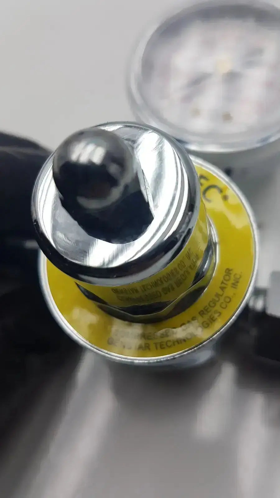 Gentec CGA950 compressed air regulator silver metal with yellow label and black knob for 60 PSI outlet pressure
