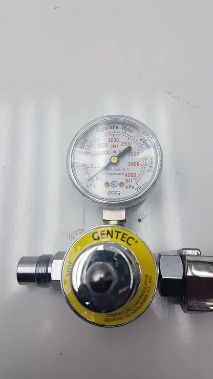Gentec CGA950 compressed air regulator with silver metallic body yellow label and gauge displaying psi and kpa measurements