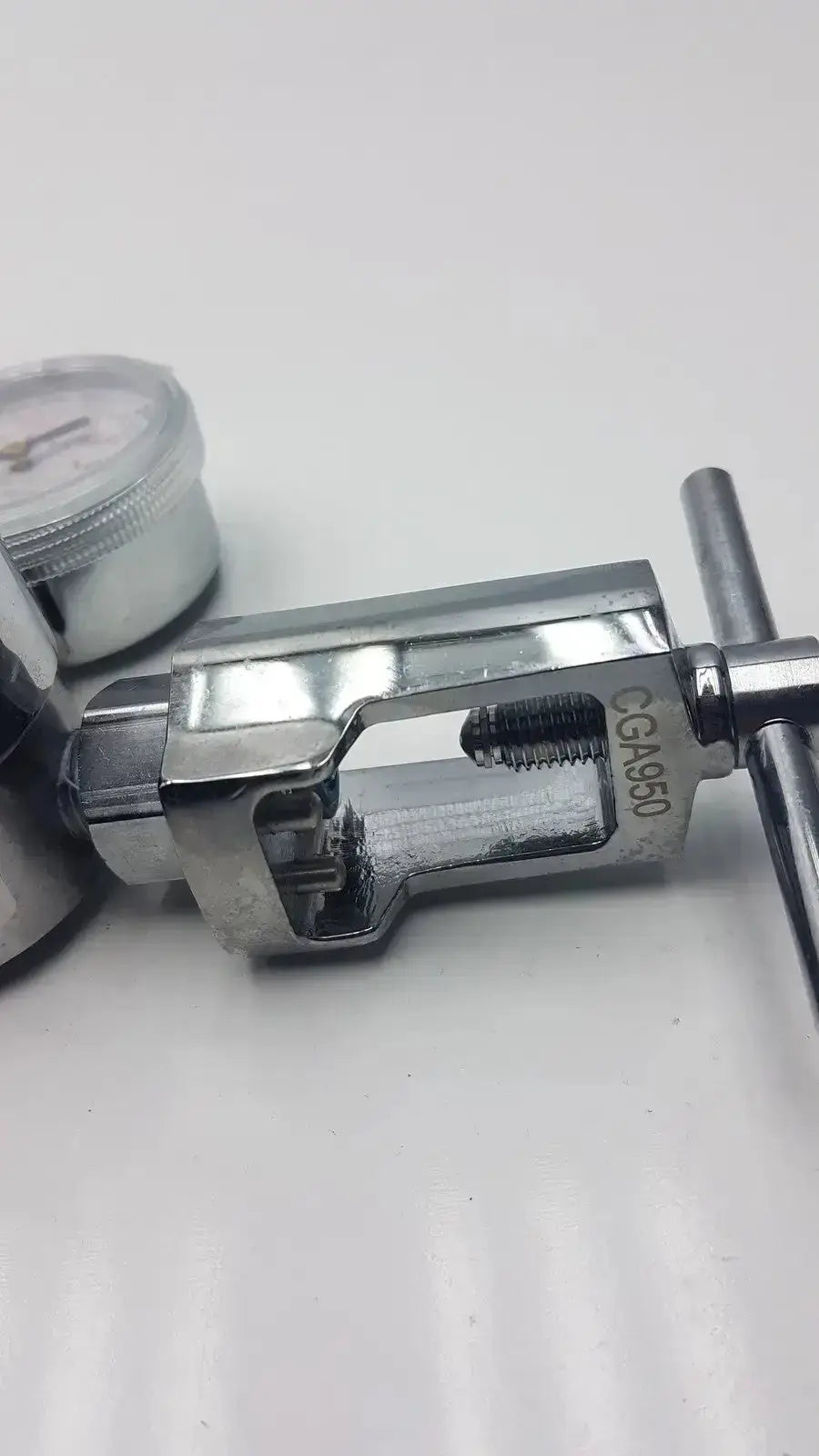 Silver metallic gentec cga950 compressed air regulator with engraved cga950 marking and threaded connection point