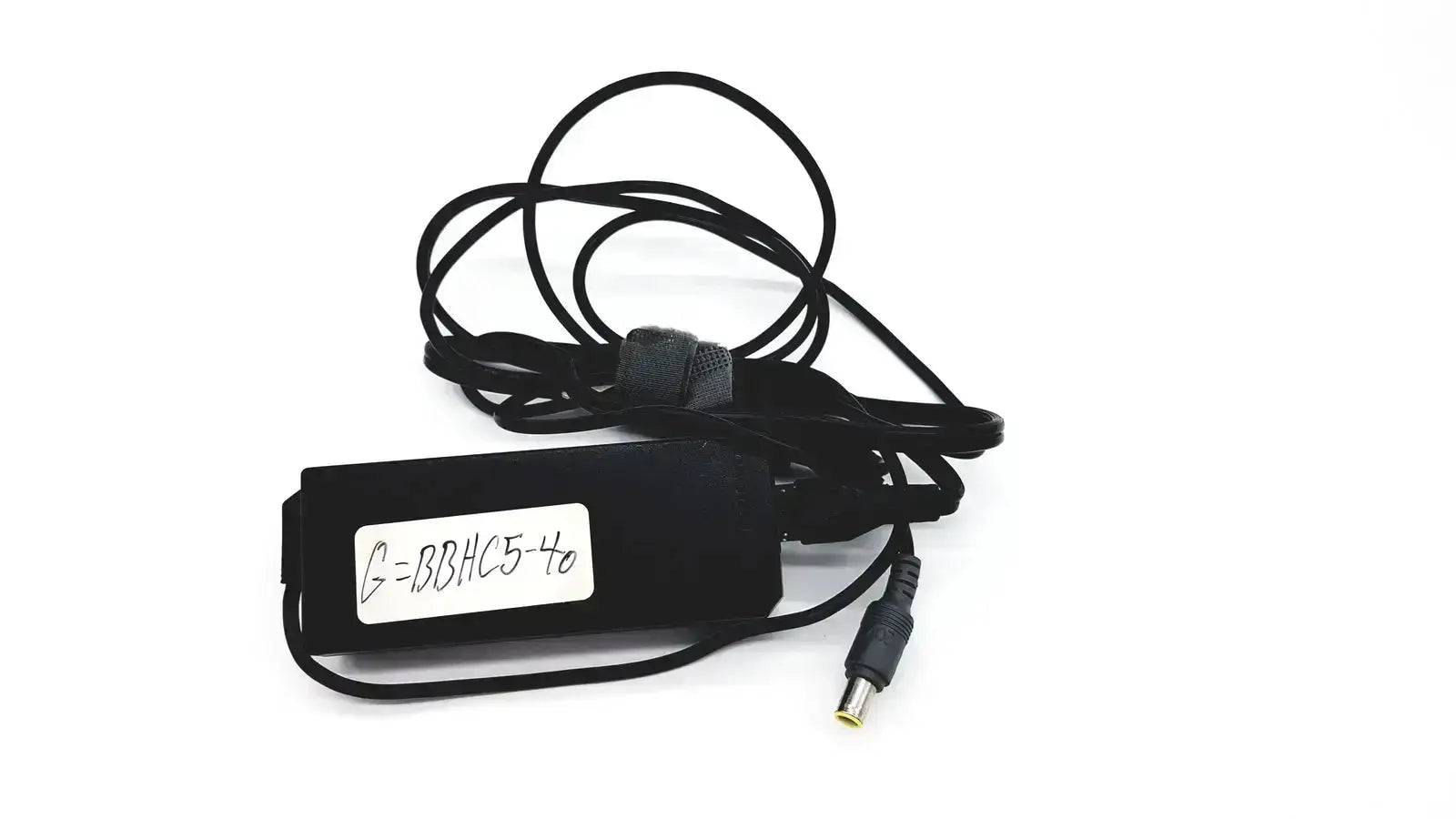 Black plastic lenovo 90w power supply with round tip 42t5000 and coiled cable featuring a small white label