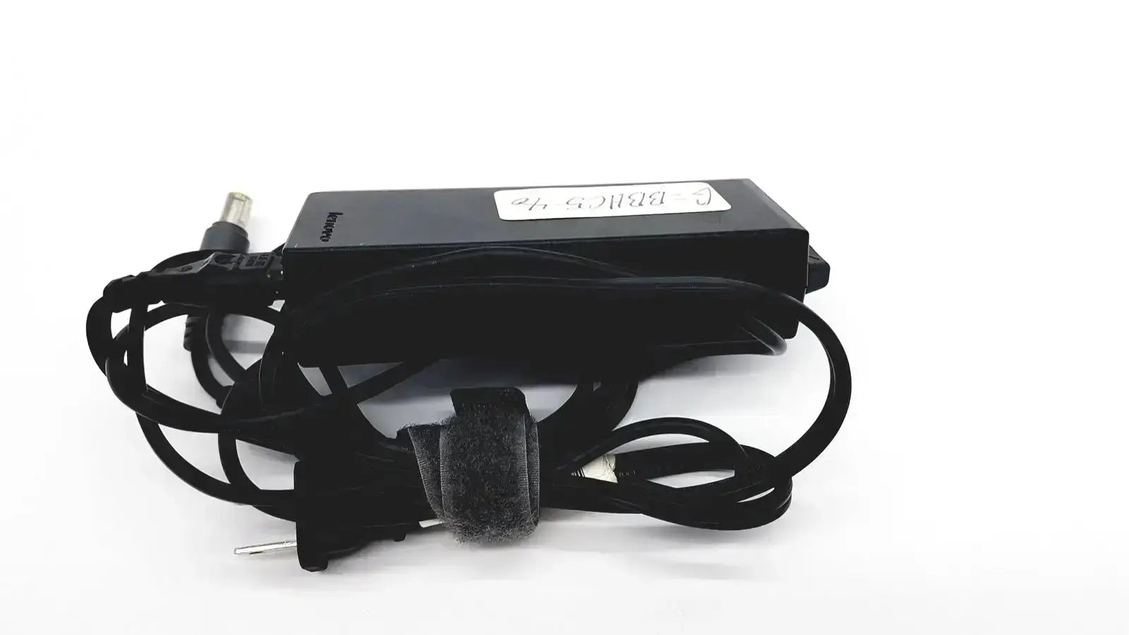 Black lenovo 90w genuine power supply with round tip 42t5000 featuring coiled cord and fabric strap securing cable