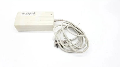 Beige plastic spacelabs snp-a085-3y ac adapter with coiled gray power cord for used medical equipment for sale