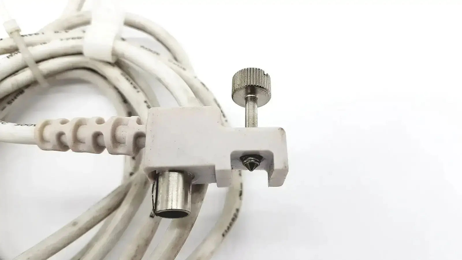 White coiled cable with gray plastic connector and metal knob for spacelabs snp-a085-3y used medical equipment for sale