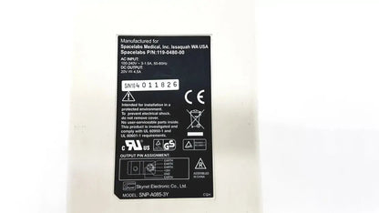 Black rectangular label with white text showing product specifications for spacelabs snp-a085-3y adapter used medical equipment for sale