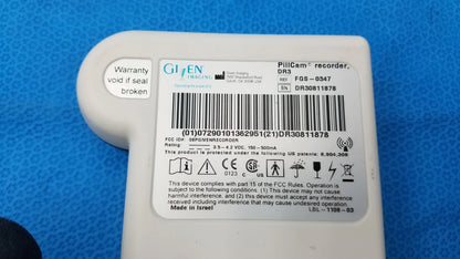 White plastic pillcam recorder dr3 with technical label for gastrointestinal imaging offered as pre owned medical equipment