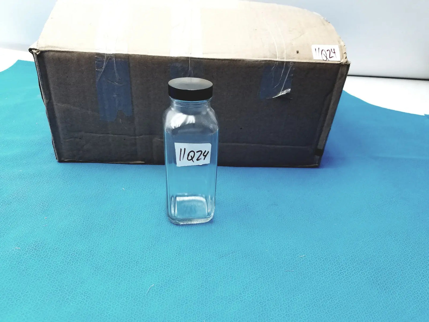 Glass Bottle with Black Cap Marked “84” – Lab Container, Storage Jar