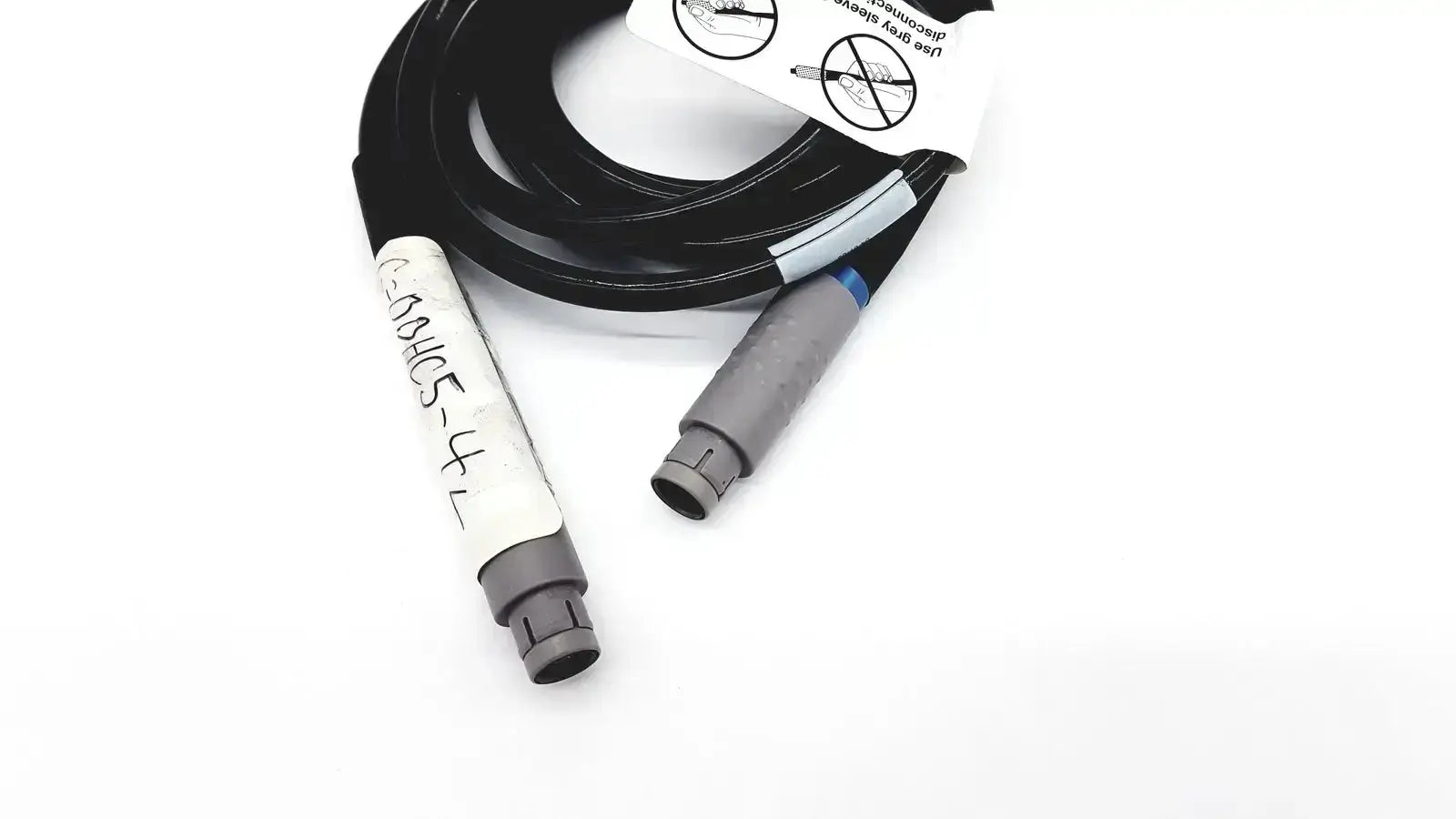 Black coiled glideScope 0600-0237 GS connector cable with gray connectors and handwritten white label for medical use