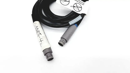 Black coiled glideScope 0600-0237 GS connector cable with gray connectors and handwritten white label for medical use