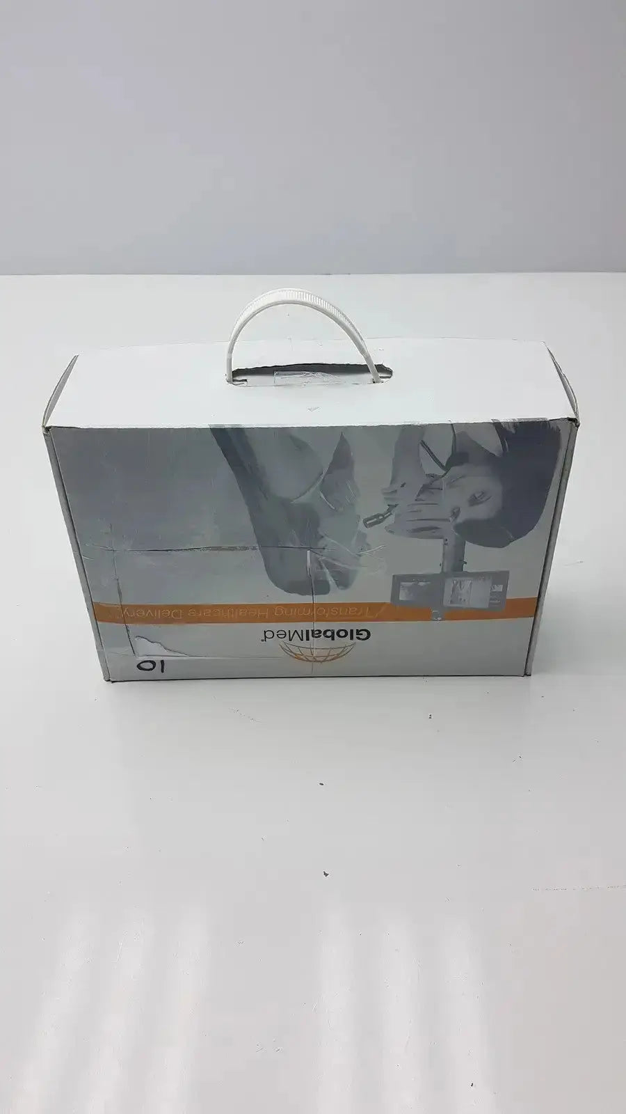 White cardboard box with silver handle and orange branding for globalmed total exam ke018257 hd 1080p camera
