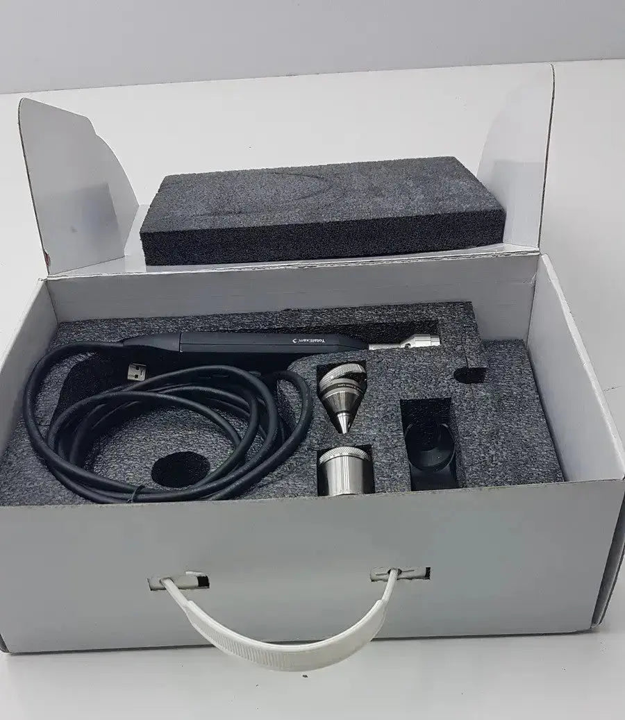 Black and silver handheld laser engraving machine with precision metal tips and coiled cable in foam box for globalmed total exam ke018257 hd 1080p