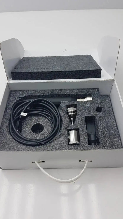 Black coiled cable and metallic components in gray foam-lined box for globalmed total exam ke018257 hd 1080p camera