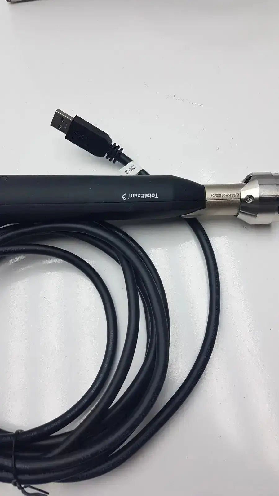 Black handheld usb cable with metallic connector branded totalexam 3 for globalmed total exam ke018257 hd 1080p camera