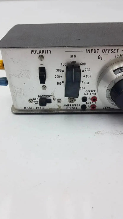 White and black metal grass instrument amplifier model p17b with labeled dials switches and input output ports