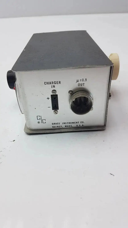 Silver metallic rectangular grass instrument amplifier model p17b back with black top and labeled ports including threaded output connector