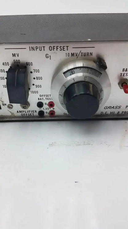 Silver-faced grass instrument amplifier model p17b control panel with black rotary knob and labeled analog dials