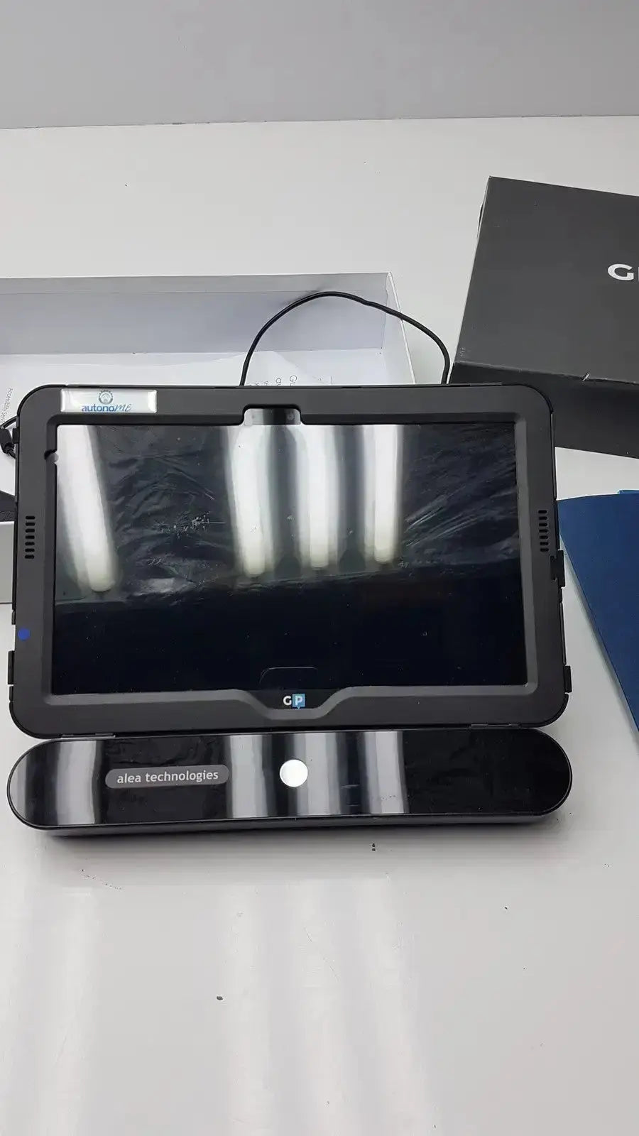 Black rugged grid pad tablet with protective case and attached speaker system used medical equipment for sale g-bbda2-10d