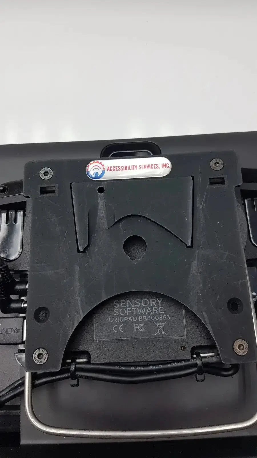Black plastic mounting plate with silver metal handle labeled sensory software gridpad bb800365 used medical equipment for sale