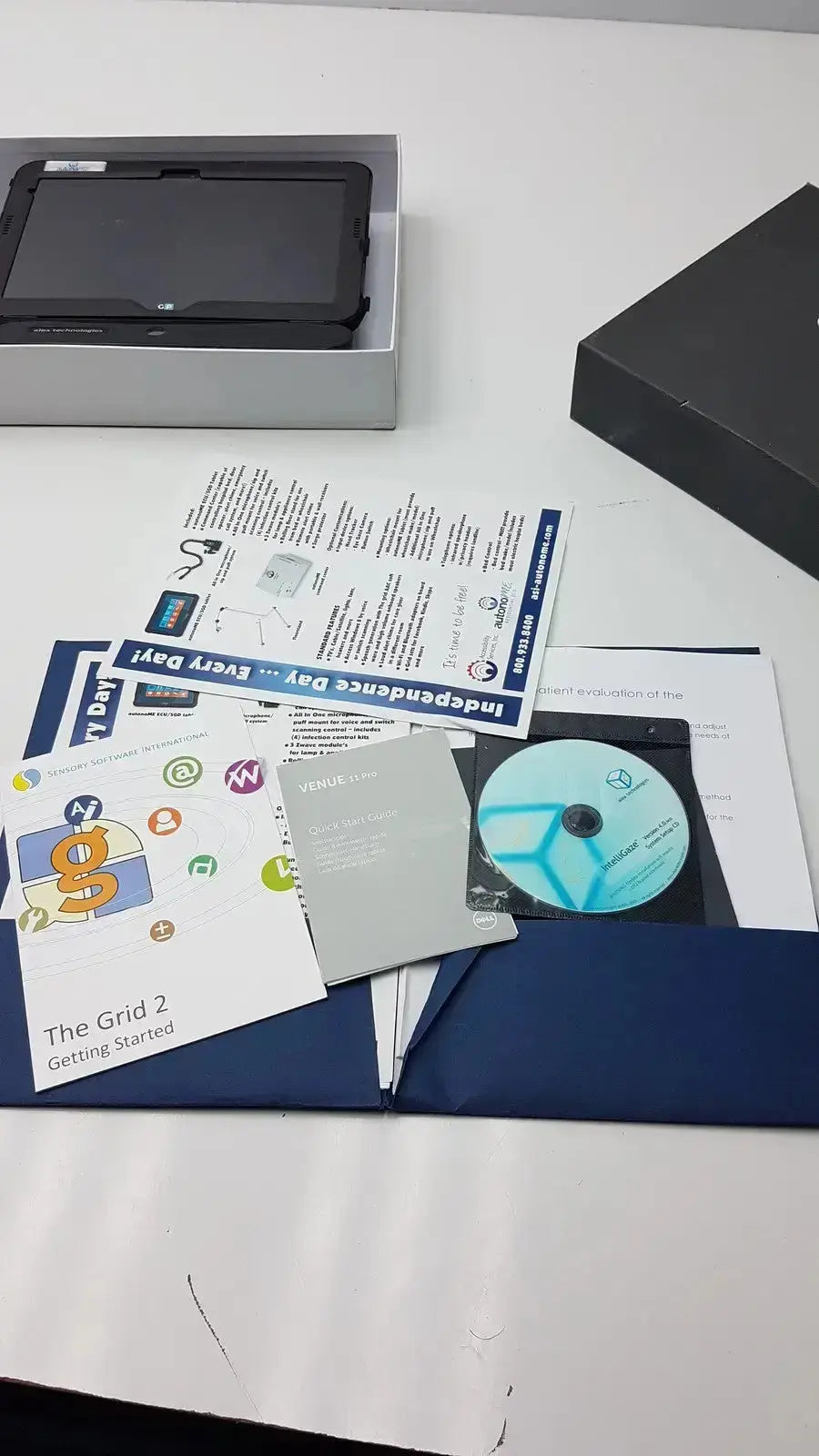 Black grid pad tablet in silver box with manuals and software discs for g-bbda2-10d used medical equipment for sale