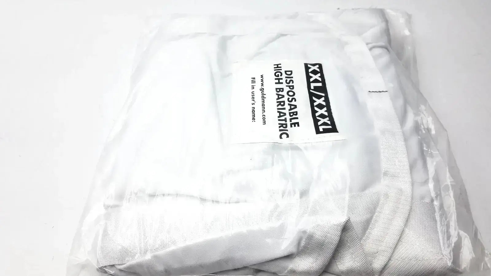 White guldmann disposable bariatric sling made of high barrier fabric in size xxl xxxl wrapped in clear plastic packaging