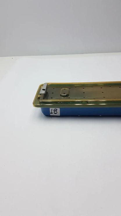 Gyrus MRA-GT slimline sterilization tray with blue plastic base and gold perforated metal lid for reuse medical equipment