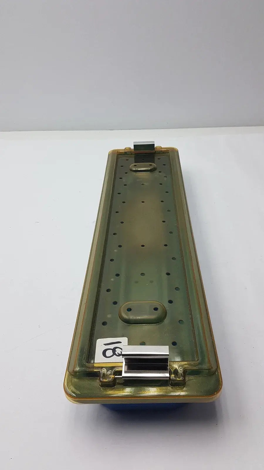 Olive green plastic gyrus MRA-GT slimline sterilization tray with metallic clasp and perforated surface for reuse medical equipment
