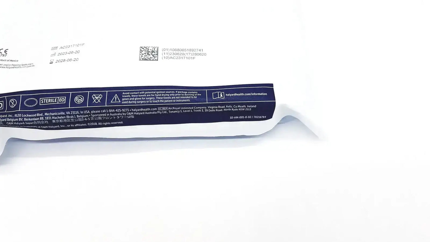 White sterile surgical glove package with blue labeling for halyard 89274 orthoarts shoulder split drape 112in x 60in exp 2028 general drapes