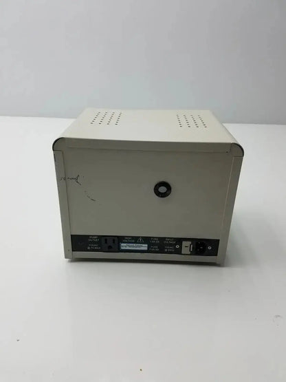 Beige rectangular harrick pdc-32g compact plasma cleaner sterilizer back side with ventilation panels and black circular port