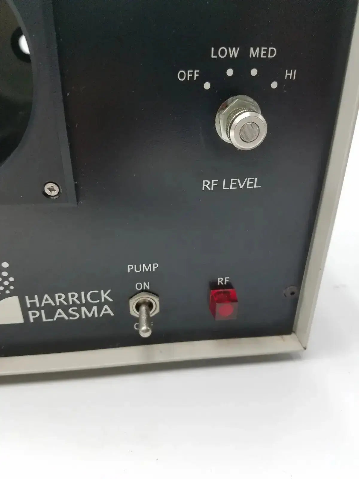 Black harrick plasma cleaner sterilizer with silver control knob and red indicator light for compact table-top use