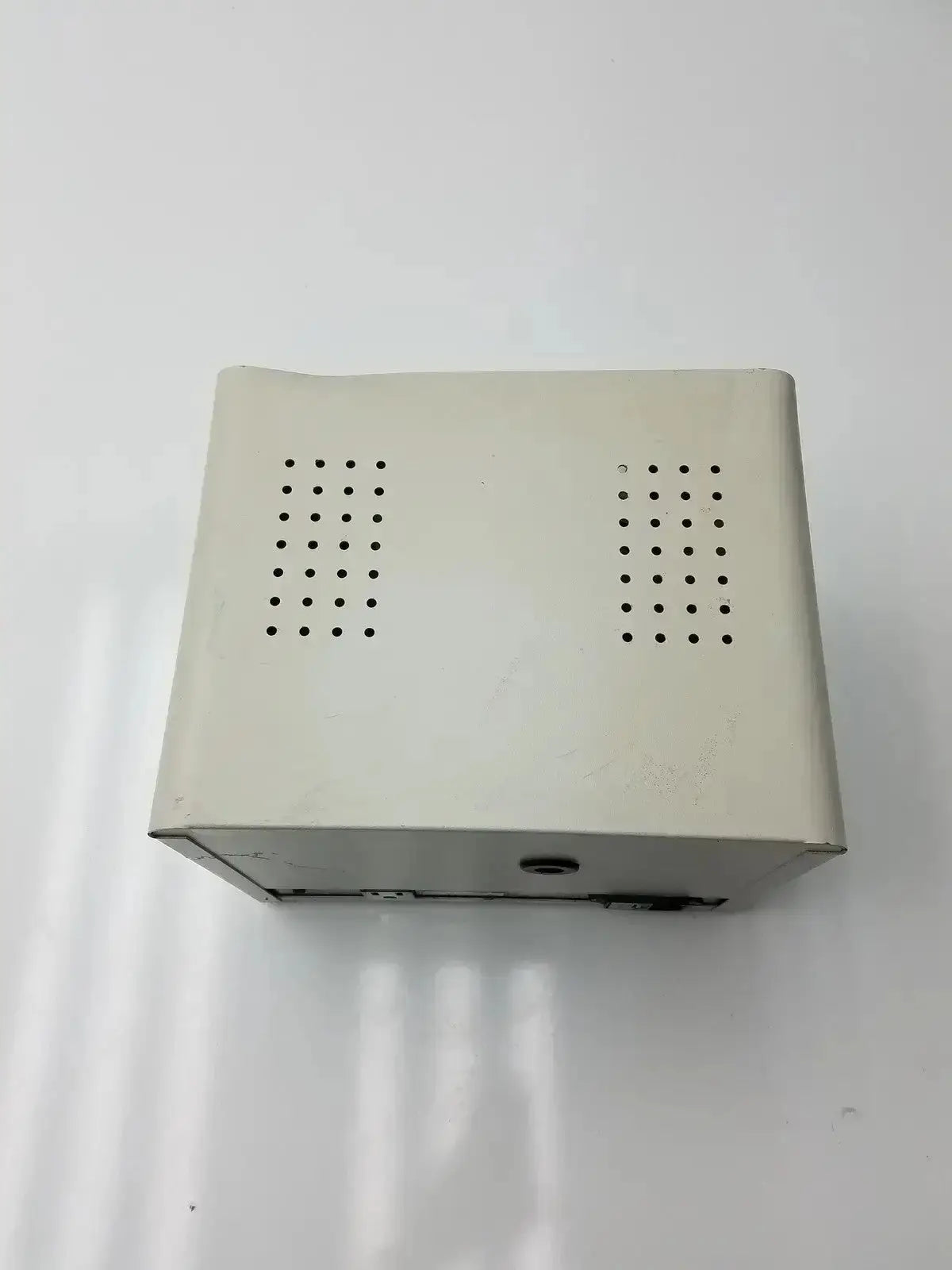 Off-white rectangular Harrick PDC-32G compact plasma cleaner sterilizer with top ventilation holes for table-top use