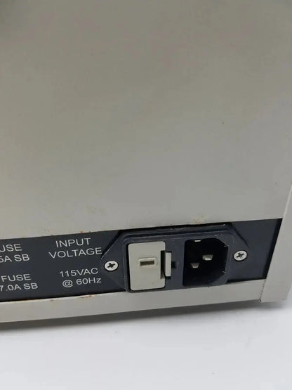 Back view of gray plastic power input panel with black grounding port and fuse compartment on harrick pdc-32g plasma cleaner sterilizer