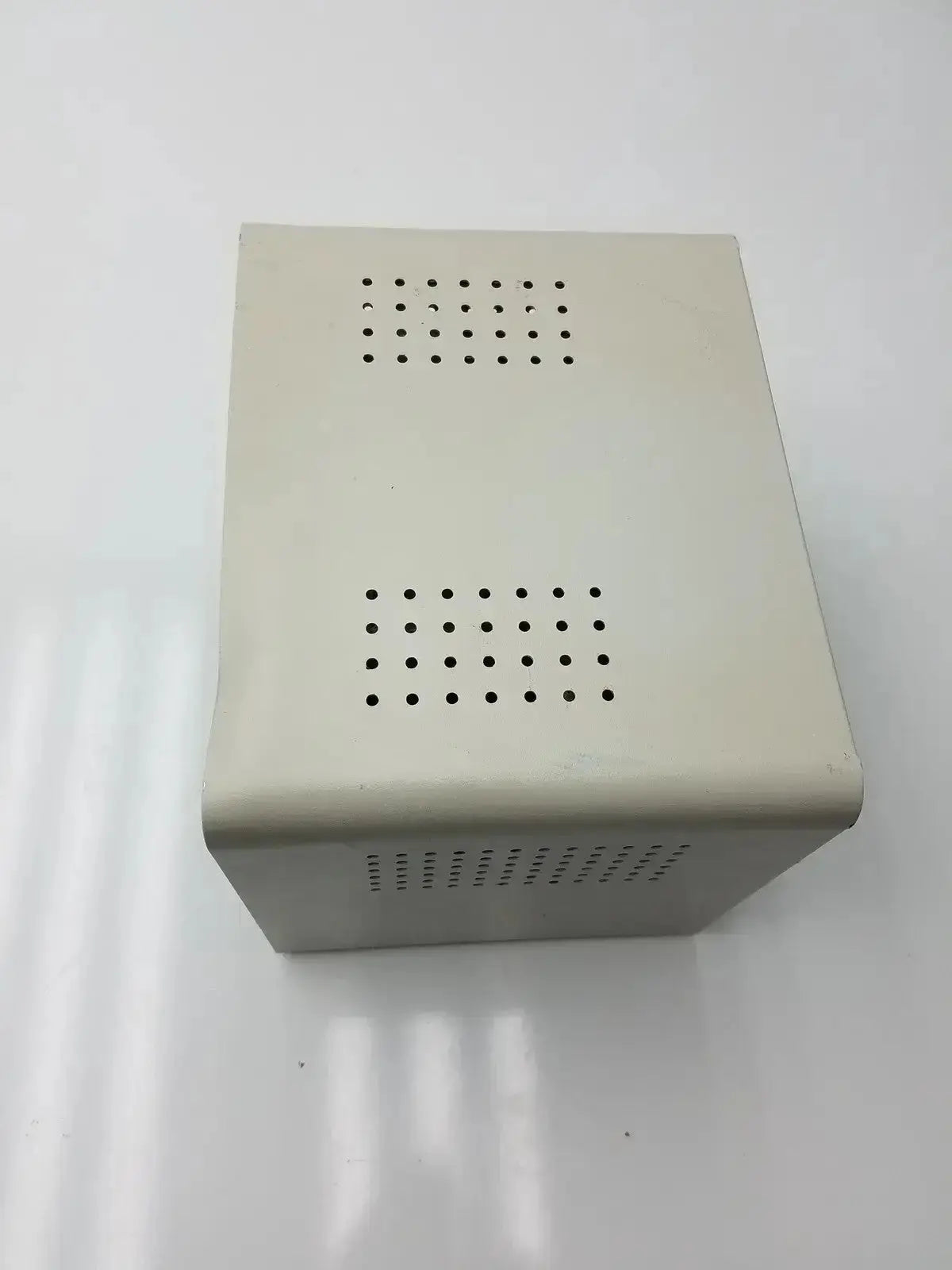 Beige rectangular metal harrick pdc-32g compact plasma cleaner sterilizer with grid-like ventilation holes on each side