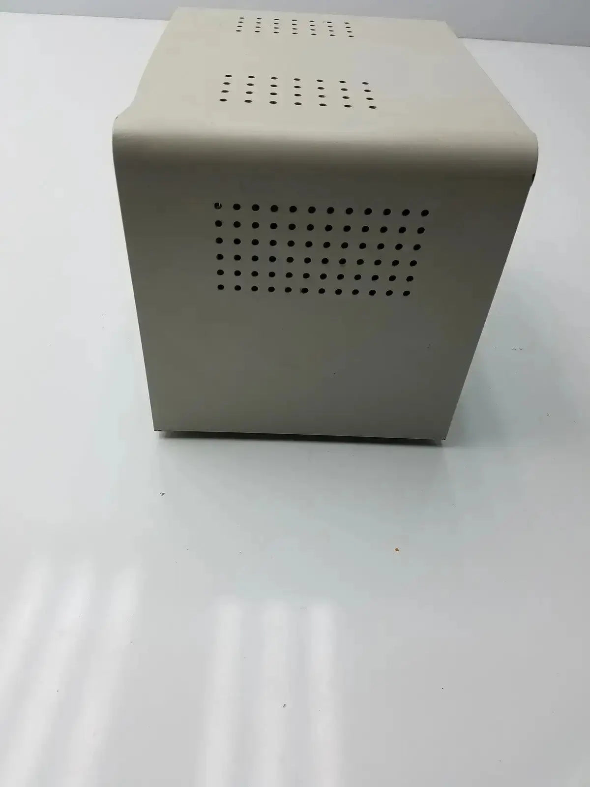 Beige rectangular harrick pdc-32g compact plasma cleaner sterilizer with perforated ventilation panels on sides for table-top use