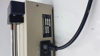 Beige Harvard Apparatus Model 11 digital single syringe pump with black power cord and metallic rod for precise dosing