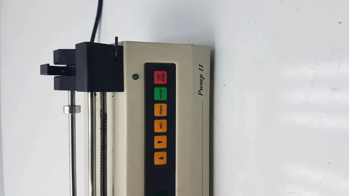 Beige Harvard Apparatus Model 11 digital single syringe pump with vertical control panel and red green orange buttons