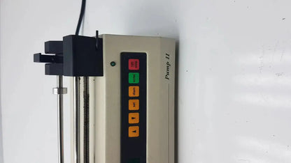 Beige Harvard Apparatus Model 11 digital single syringe pump with vertical control panel and red green orange buttons