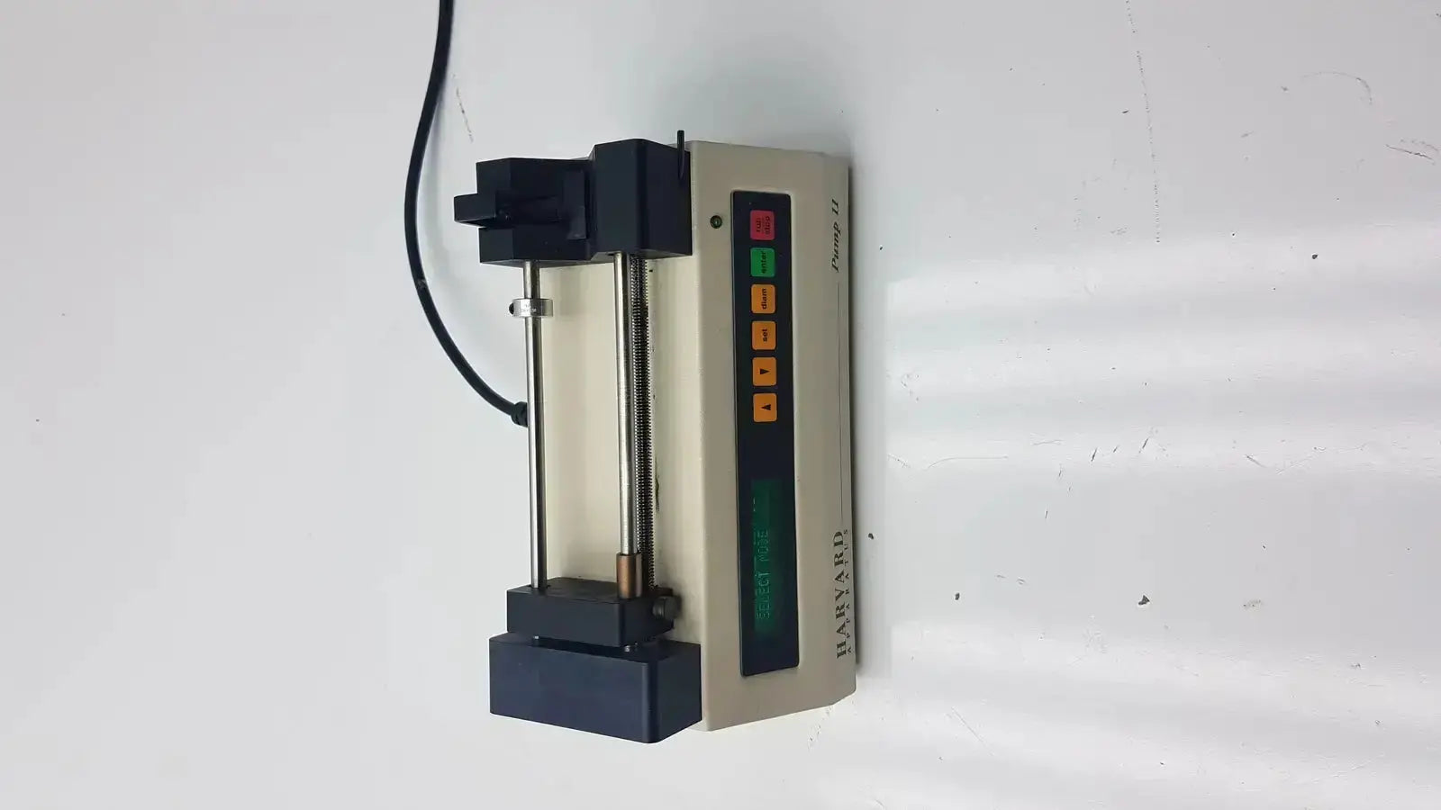 Beige and black harvard apparatus model 11 digital single syringe pump with lcd display and colored control buttons